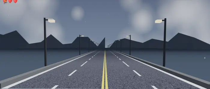 Storm world: a grey coastal road under heavy cloud.